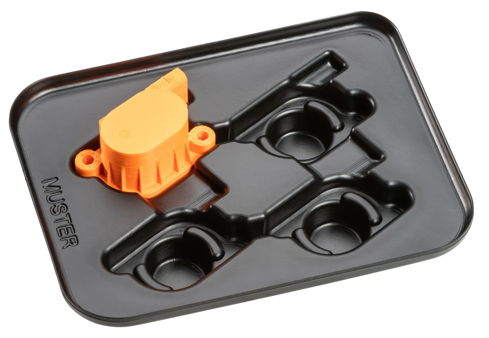 Funktionsnachweis: Orangefarbenes Kunststoffteil formschlüssig in der 3D-gedruckten Tiefziehform